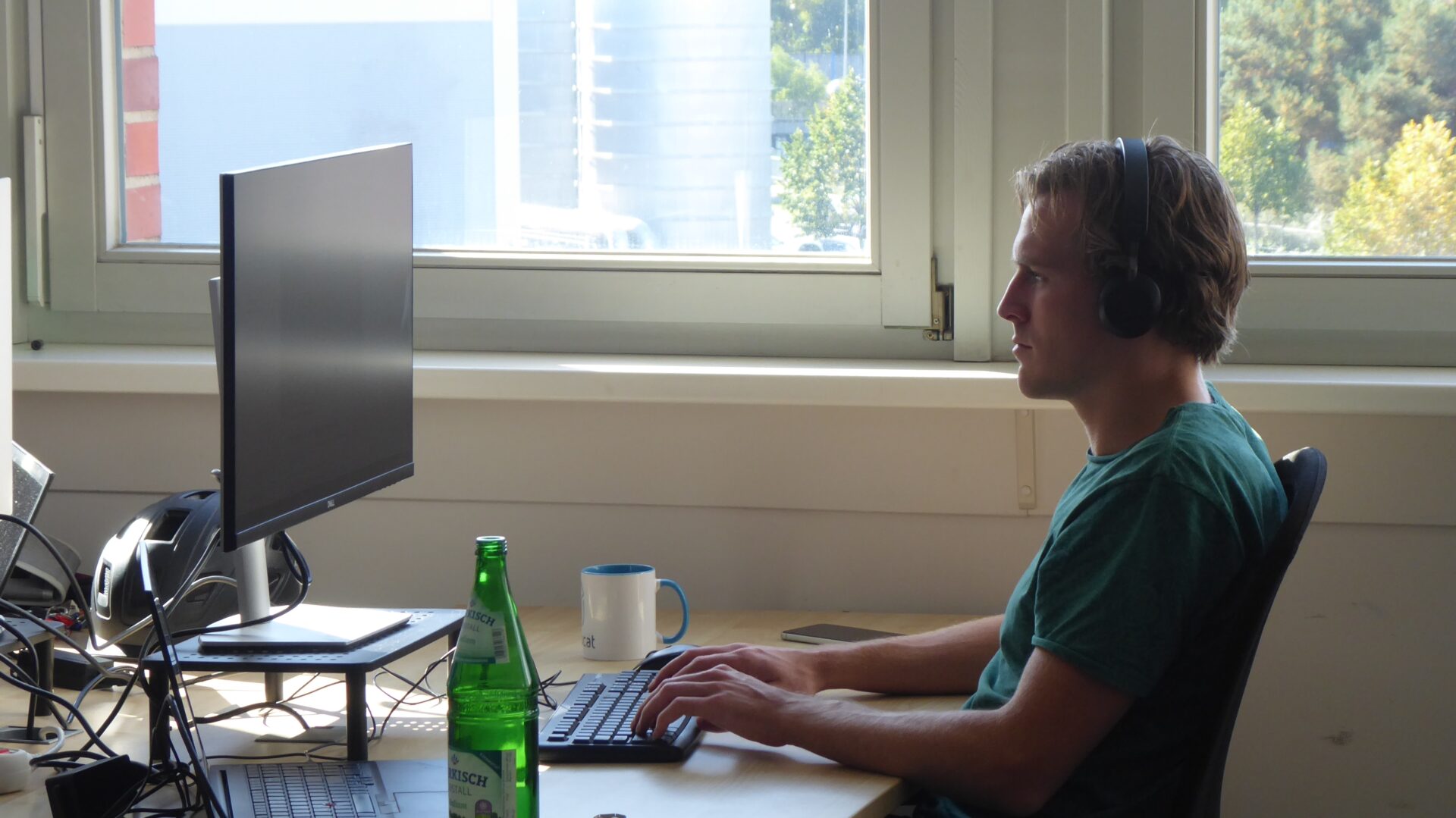 one_person_working_sideshot_logo_removed